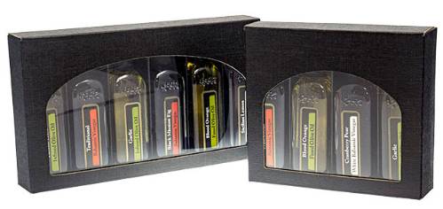 60ml olive oil box — flat black linen-embossed box with an oval window and insert holding 6 small tasting bottles