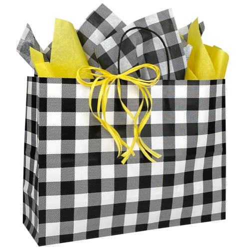 White kraft paper shopping bag in a black-and-white plaid check, twisted paper handles