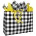 White kraft paper shopping bag in a black-and-white plaid check, twisted paper handles