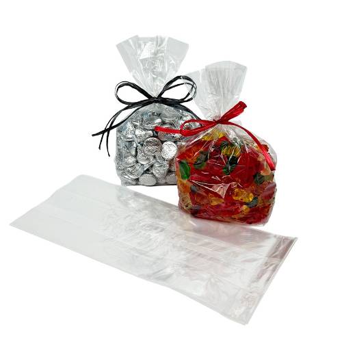Two clear cellophane side-gusset bags of foil-wrapped chocolates and gummy candy tied with ribbon, plus an empty flat bag