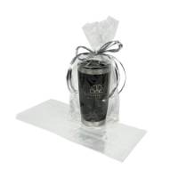 Clear cellophane side-gusset bag holding a stainless travel tumbler tied with silver ribbon, beside an empty flat bag