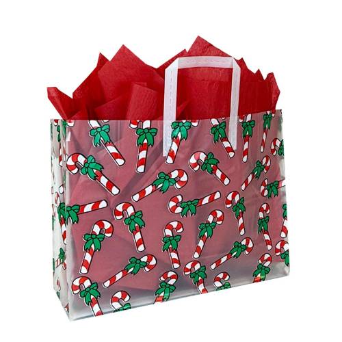 Red-and-white candy cane print with green bows on a frosted clear poly shopping bag with soft loop handles — 16 x 6 x 12