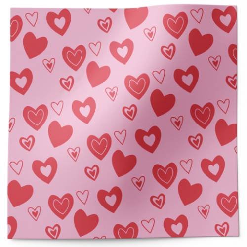 Candy hearts printed tissue paper with red and pink heart pattern on pink background