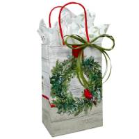 White kraft paper shopping bags with green wreath and red cardinal, red twisted handles