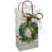 White kraft paper shopping bags with green wreath and red cardinal, red twisted handles
