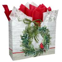 White kraft paper shopping bags with green wreath and red cardinal, red twisted handles