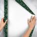 Forest Snowflakes gift wrap paper unrolled to show the white reverse side of the roll