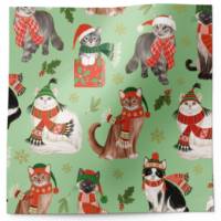 Frolicking felines tissue paper with Christmas cats in scarves and hats on soft green