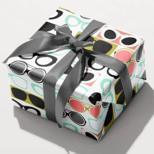 White closeout gift wrap printed with rows of retro sunglasses and eyeglass frames in black, mint, coral, and olive