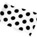 Ink spots printed tissue paper with bold black polka dots on a white background