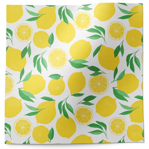 Lemons tissue paper with bold yellow whole and sliced lemons and green leaves on white