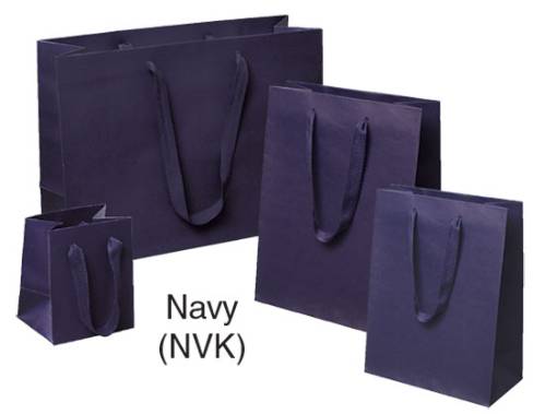 Navy blue Manhattan shopping bags in matte uncoated paper with flat woven cotton-twill handles, shown in multiple sizes