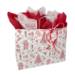 White paper shopping bag with nutcracker toile festive Christmas print and twisted kraft handles