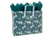 White dragonfly-and-floral print on a frosted clear poly shopping bag with soft loop handles — 16 x 6 x 12