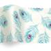 Peacock printed tissue paper with teal peacock feather pattern and jewel-tone accents