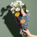 Pretty Poppies printed tissue paper wrapped around a fresh flower bouquet