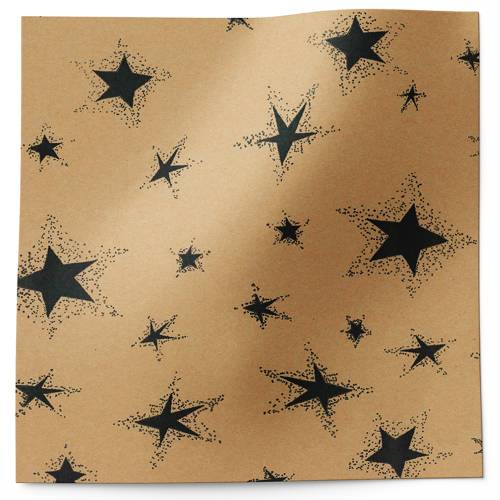 Primitive-style black star tissue paper with hand-stamped stars in varying sizes on a warm kraft background