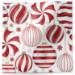 Red and white ornaments tissue paper with bold striped peppermint ornaments on white