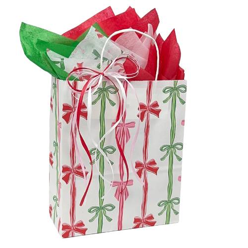 Rows of Bows Paper Shopping Bags — white kraft with repeating rows of red, green, and gold gift bows, twisted handles, cub