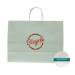 White paper shopping bag with seafoam green print and twisted paper handles