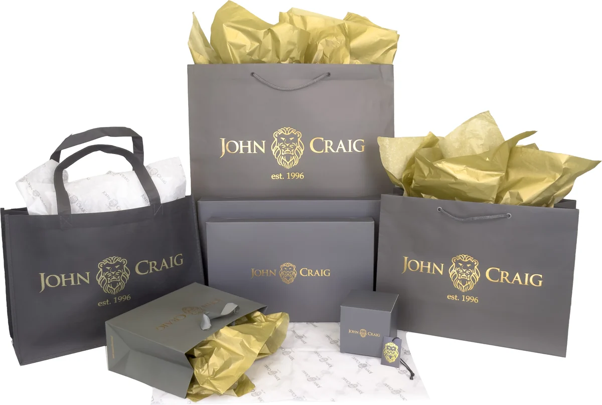 Custom printed charcoal and gold shopping bag suite for John Craig