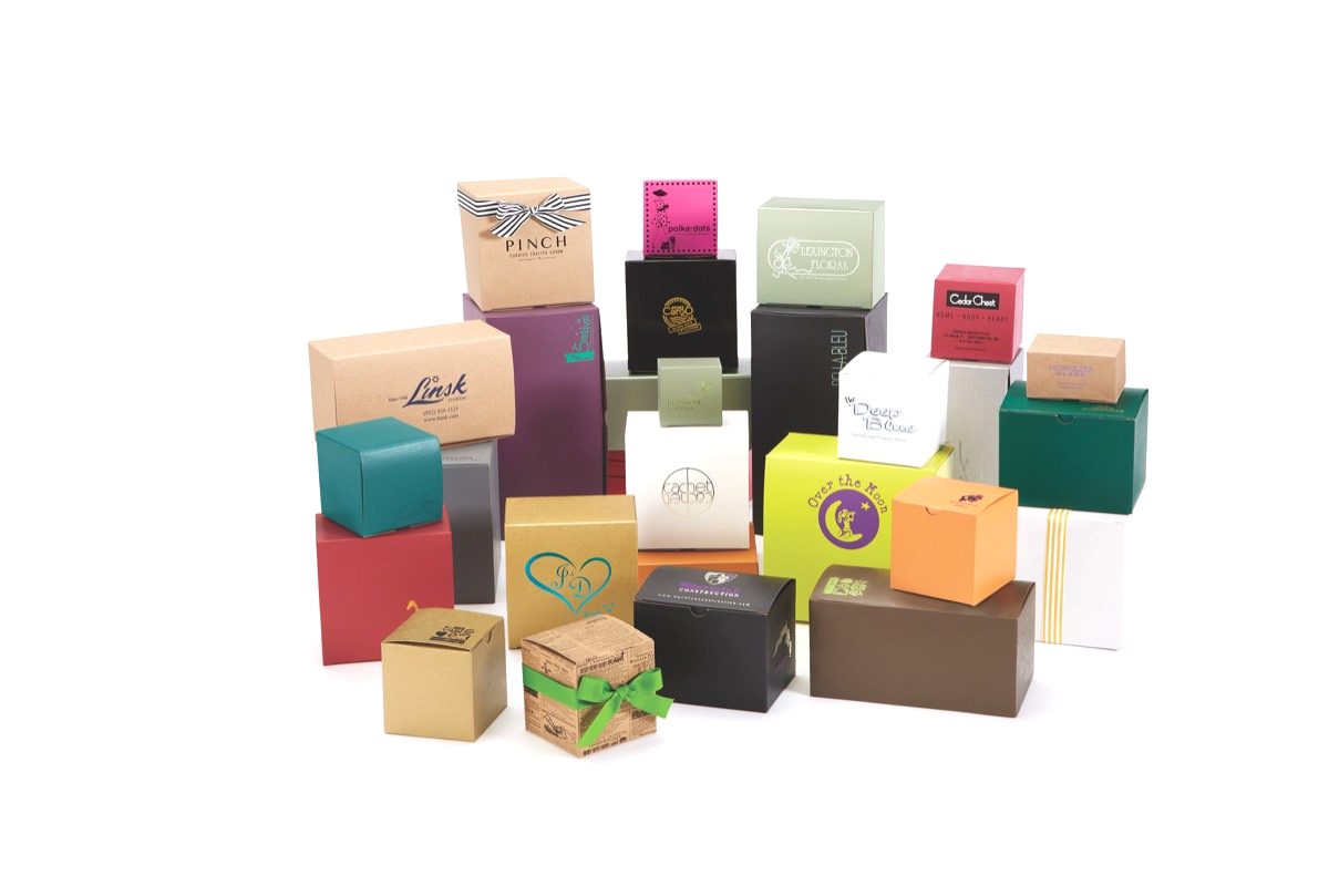 Gift boxes in many colors, each custom printed or hot stamped with a different store logo