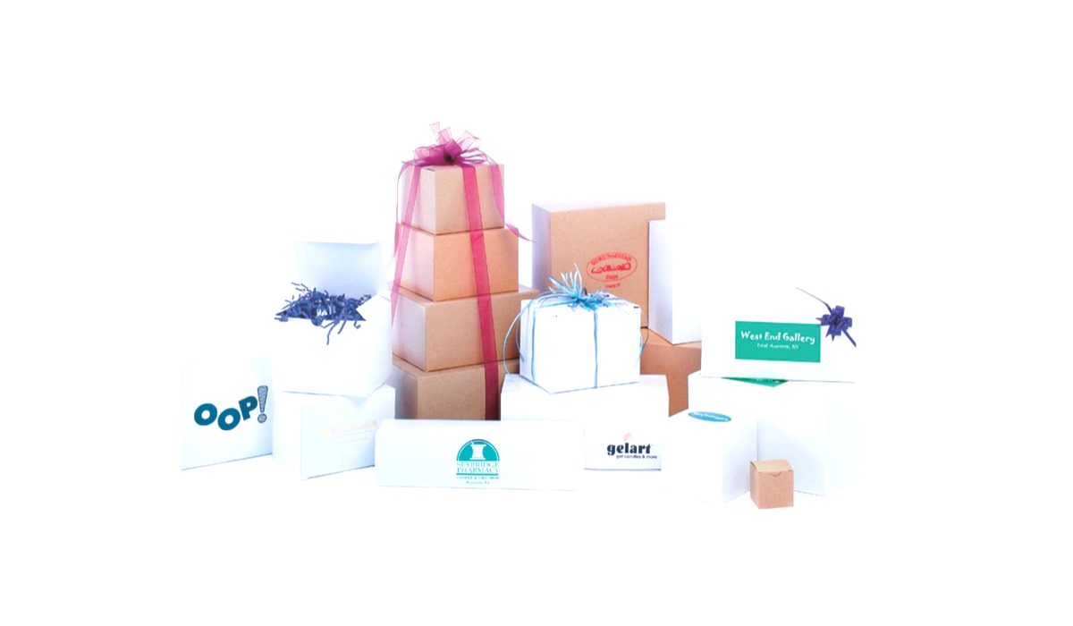 White and natural kraft one-piece gift boxes with custom printed store logos, stacked as a gift tower