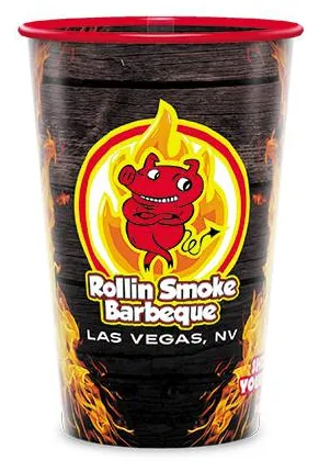 Custom printed 22 oz clear plastic cup with a printed red rim for a barbecue restaurant