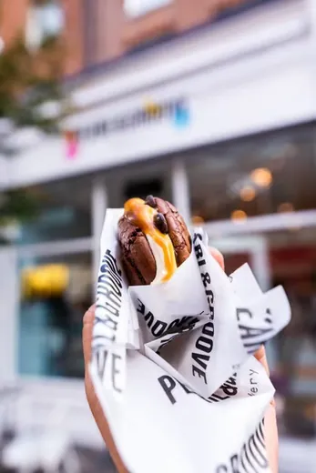 Sandwich wrapped in custom printed deli paper
