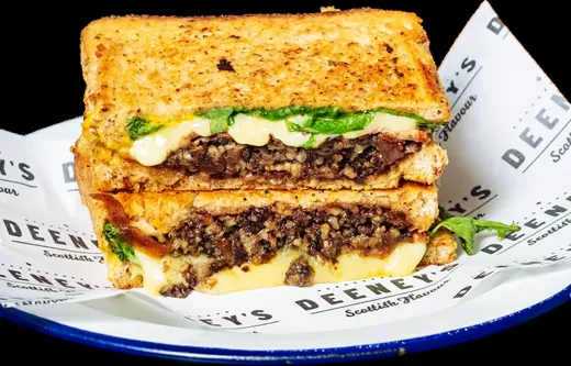 Grilled cheese on custom deli paper with a printed logo