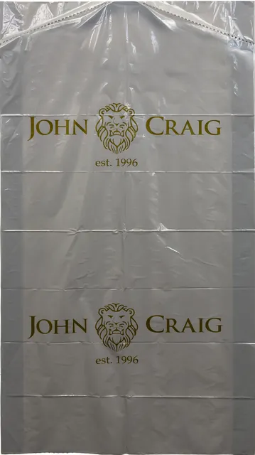 Clear plastic garment bag with a gold logo repeated down the film