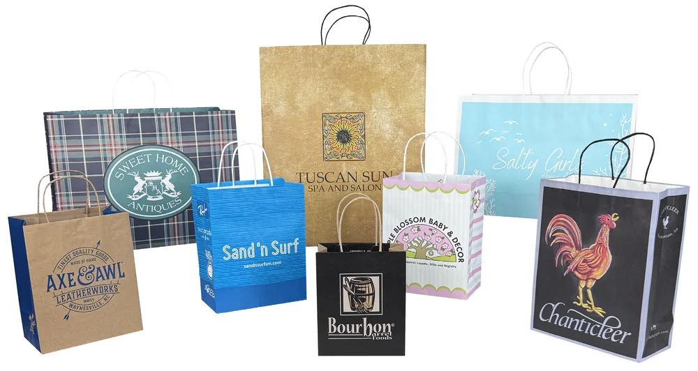 Made to order J-Cut paper shopping bags with fold-over tops and bottom boards, printed all over in full color