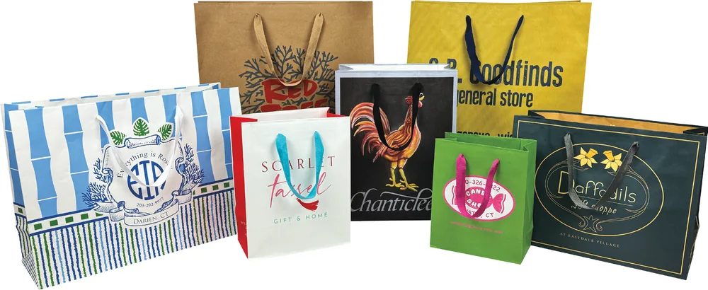 Made to order twill handle paper shopping bags printed in full color with colored ribbon handles