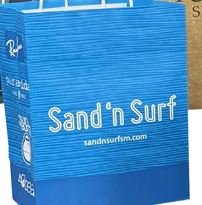 Blue paper shopping bag with a full bleed texture print