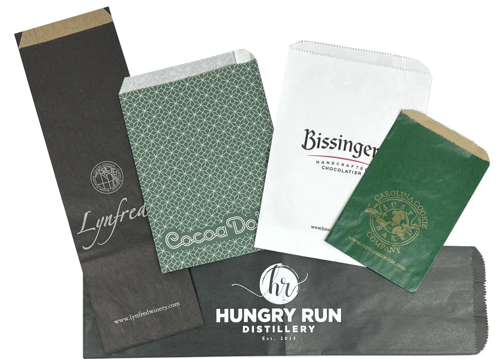 Custom printed paper merchandise bags, flat and gusseted, with one and two color logos on colored, white and patterned paper