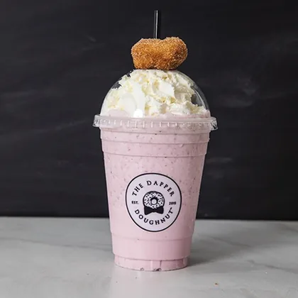 Custom printed clear plastic cup with a dome lid for a doughnut shop