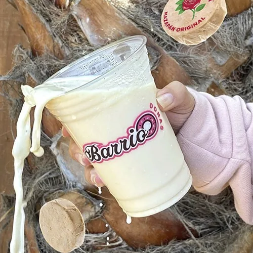 Custom printed clear plastic cup with a horchata for a taqueria