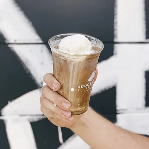 Custom printed clear plastic cup with a coffee float