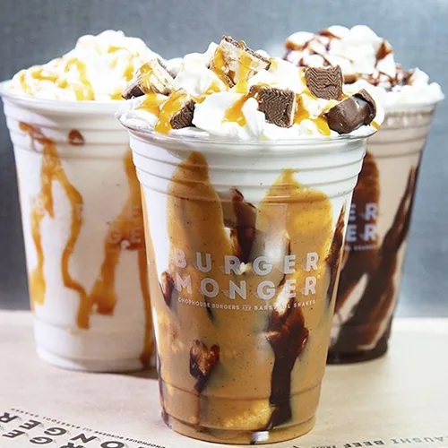 Two custom printed clear plastic cups with loaded shakes