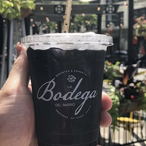 Custom printed plastic cup with a flat lid for a grocery and deli