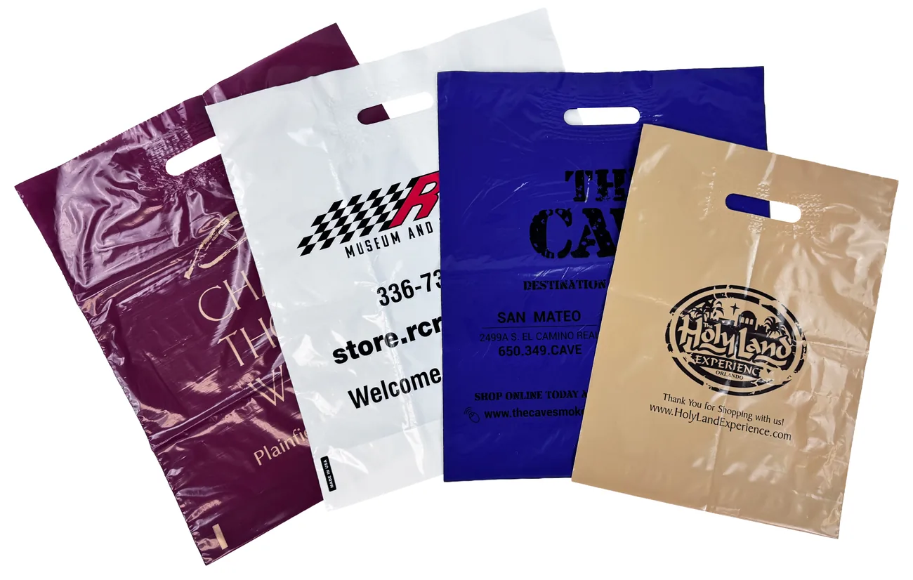 Four custom printed patch handle plastic bags in burgundy, white, dark blue and tan film, each with a reinforcing patch around the handle