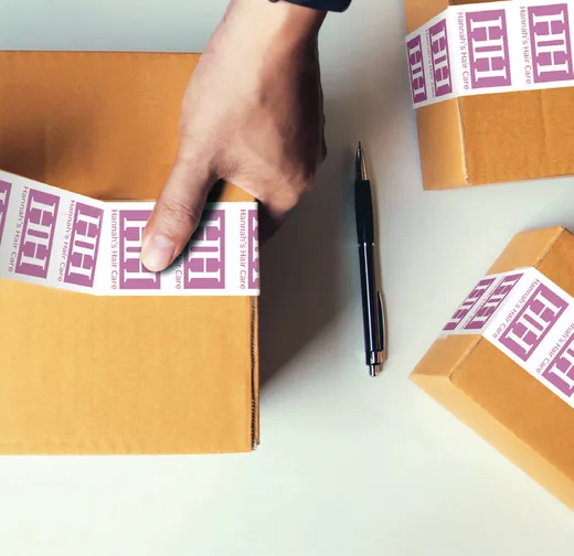 One color logo printed on white poly tape sealing a kraft carton