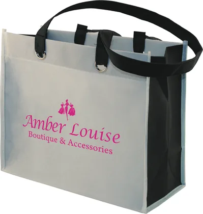 Two tone custom boutique tote with silver grommets and a logo