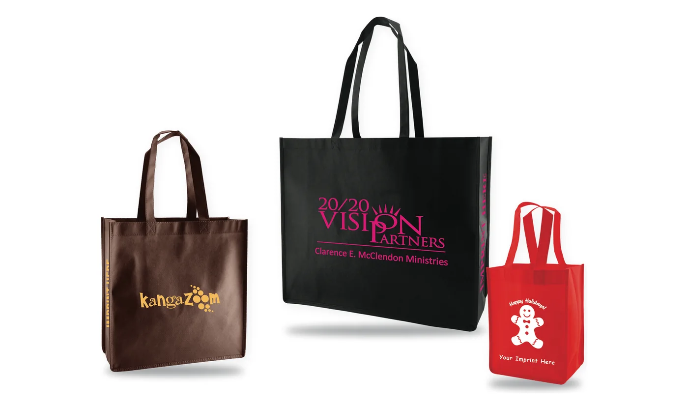 Three custom printed non-woven shopping tote bags, a chocolate tote with a gold logo, a large black tote with a pink logo and a small red tote with a white print