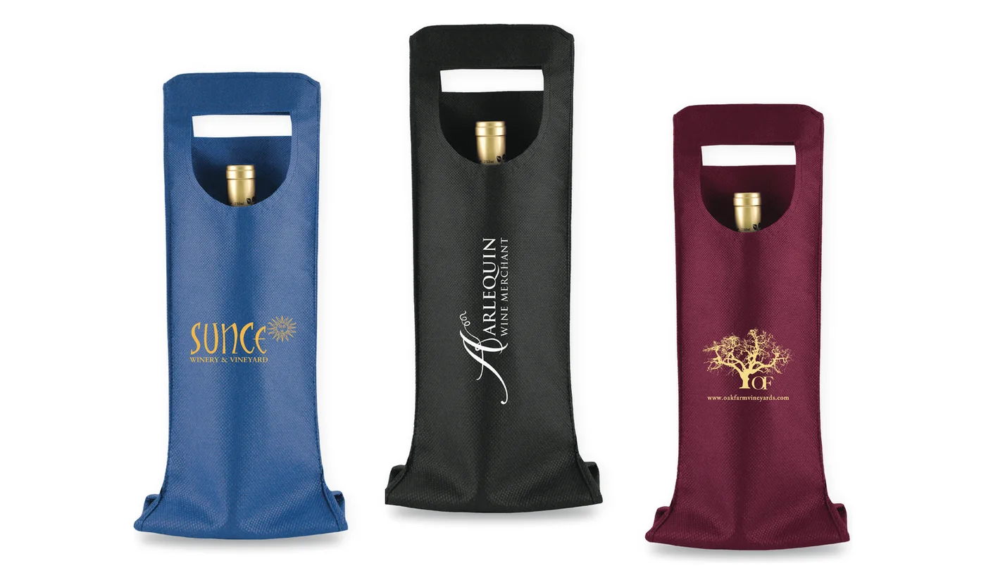 Three custom printed single bottle wine bags with a die cut handle, in royal blue, black and merlot, each with a winery logo