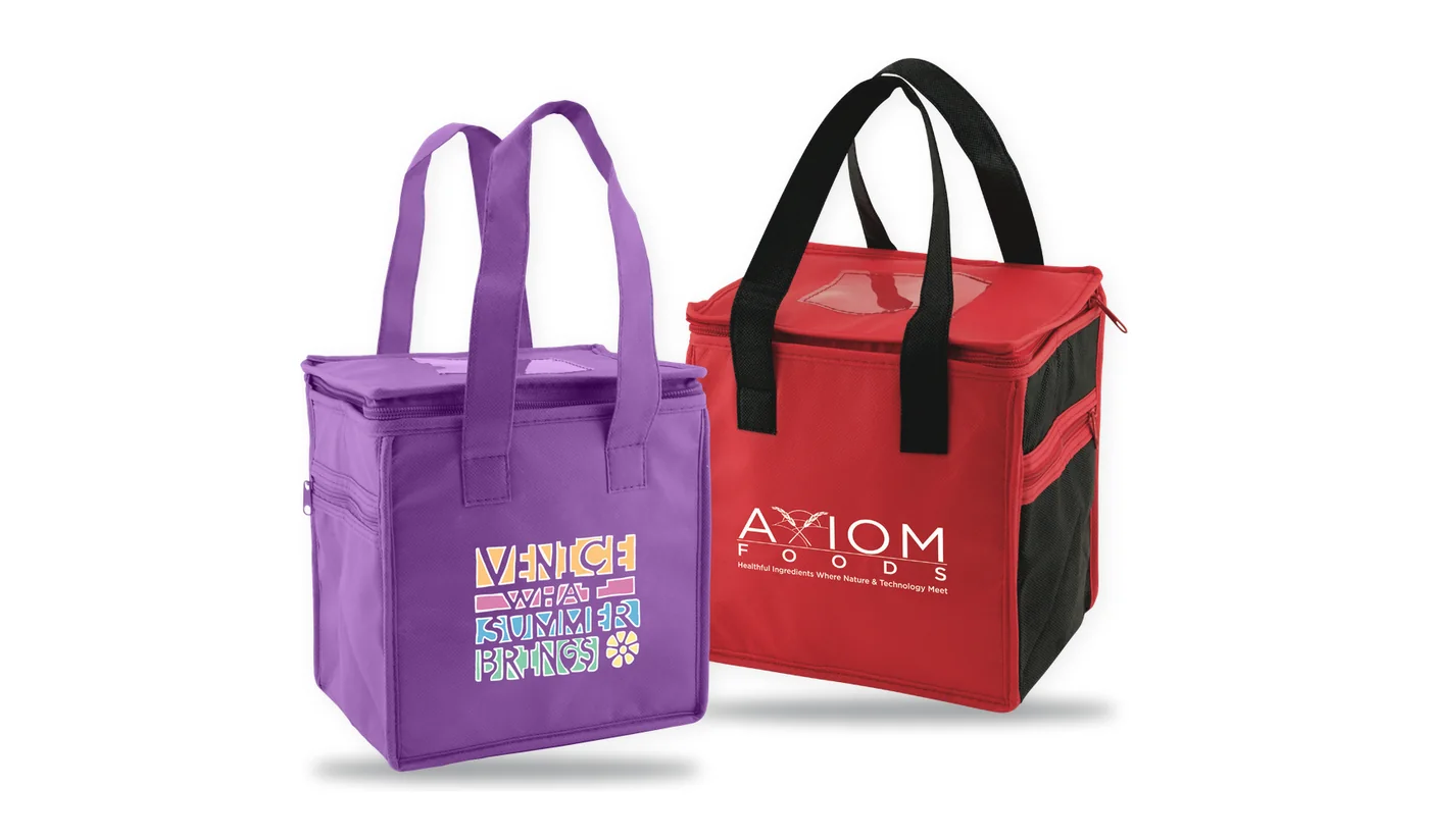 Two custom printed insulated lunch totes, a purple lunch tote with a multi color print and a red and black two tone lunch tote with a white logo