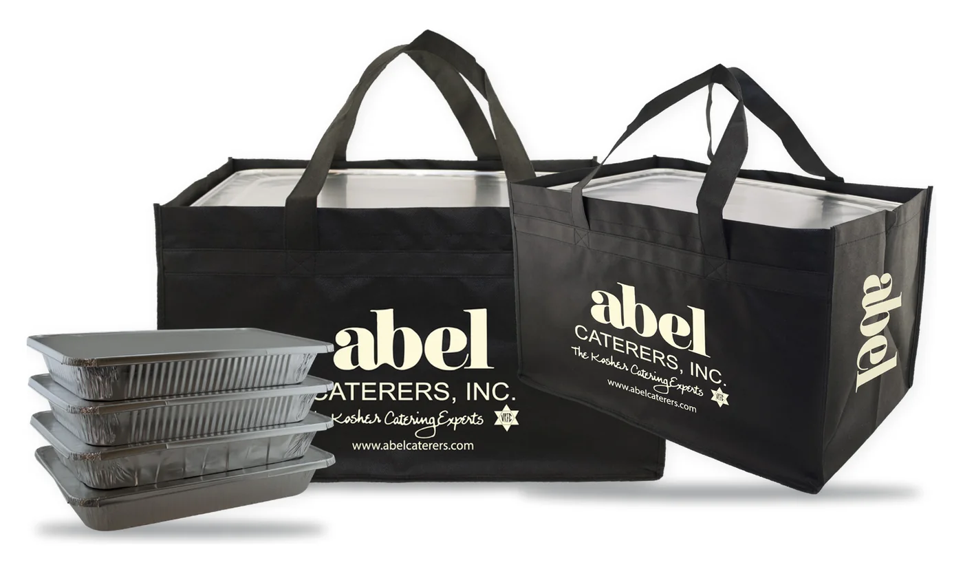 Two custom printed black catering totes with a white caterer logo, sized to hold stacked full size catering pans