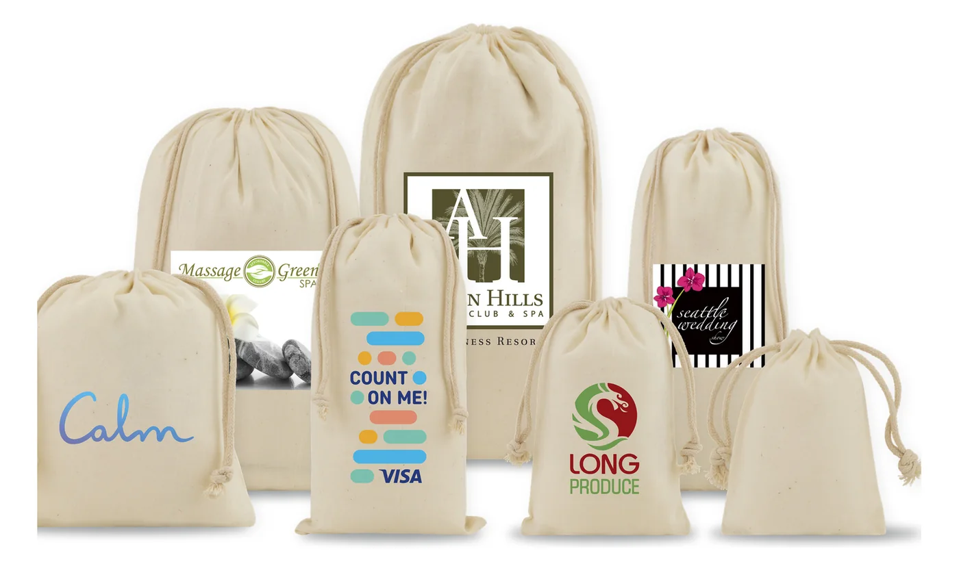 Seven custom printed natural cotton muslin drawstring pouches in graduated sizes, printed with spa, resort, wedding and produce brand logos