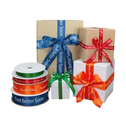 Gift boxes tied with custom hot stamped ribbon reading Feel Better Soon and Have A Nice Day