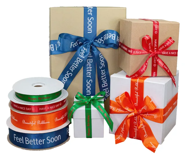 Gift boxes tied with hot stamped satin ribbon in blue, red and orange